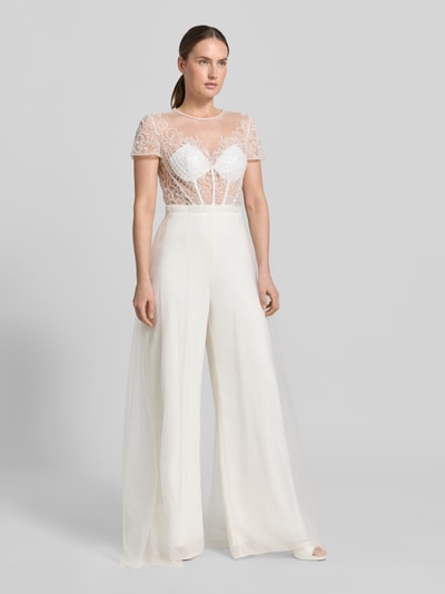 Frauenmodel trägt Jumpsuit mit Perlen und rückseitigem Cut-Out von Unique, semitransparent, Regular-Fit, Hakenverschluss, Ganzkörperansicht von vorne, Rückenlänge bei Größe 36: 40 cm, Brustweite: 38 cm, Ärmellänge: 17 cm, Gesamtlänge: 162 cm, Innenbeinlänge: 86 cm.