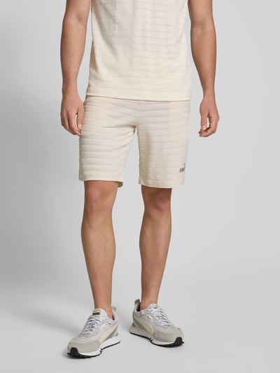 PUMA PERFORMANCE Slim Fit Shorts mit Strukturmuster Modell 'ESS ELEVATED' Offwhite 4