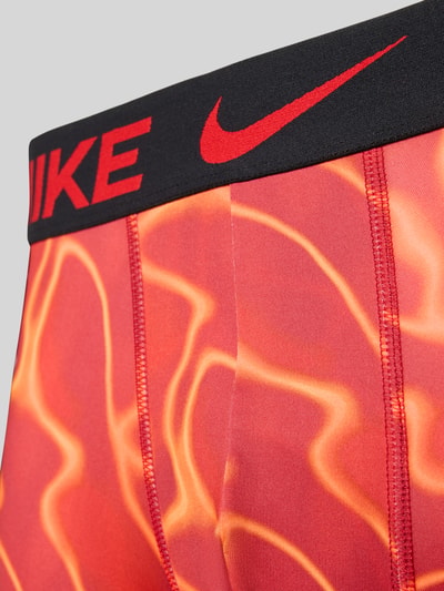 Produktfoto, Pant & Trunk mit DRI-Fit Technology Modell 'ESSENTIAL' im 3er-Pack von Nike, Herren Pant & Trunk von Nike, rot-orange Muster, schwarze Bund mit rotem Logo, glatte Textur