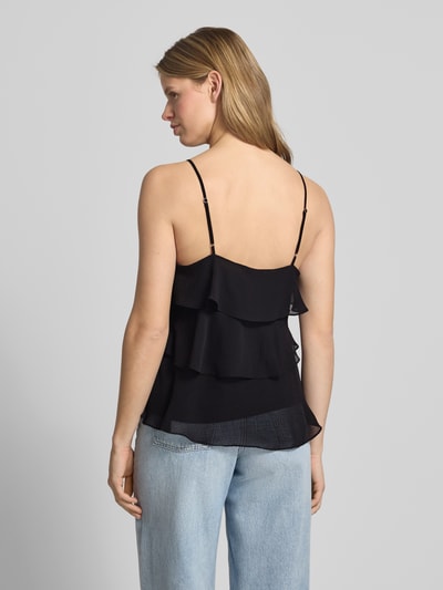 Frauenmodel trägt Regular Fit Trägertop mit Volants Modell 'LINN' von Only, Optik: Unifarben, verstellbare Spaghettiträger, Ganzkörperansicht Rückansicht.