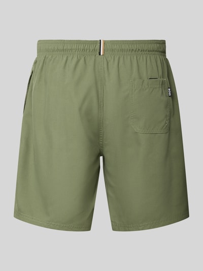 Produktfoto, Badeshorts mit Label-Schriftzug Modell 'ORCA' von BOSS, Optik: Unifarben in Grün, elastischer Bundabschluss, Tunnelzug, seitliche Eingrifftaschen, Gesäßtasche, glatte Textur
