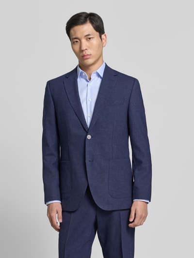 Männermodel trägt Regular Fit Anzugsakko mit Woll-Anteil Modell 'JANSON' von BOSS in Melange-Optik, Twill, Ganzkörperansicht von vorne.