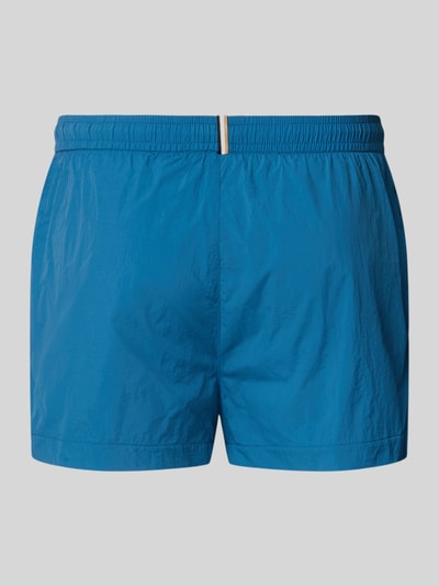 Produktfoto, Regular Fit Badeshorts mit Label Print Modell 'MOONEYE' von BOSS, Herren Badeshorts, Optik: Unifarben, Applikation: Label-Print, Bundabschluss: Elastisch mit Tunnelzug, Seitliche Eingrifftaschen, leuchtendes Blau, glatte Textur