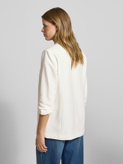 Kobiece modelka nosi Regular Fit Longblazer mit Viskose-Anteil Model 'BOSELLA' od Pieces, efekt: jednolity kolor, kołnierz z połami, poduszki na ramionach, rękaw o dł. 3/4 z marszczeniem, wykończenie materiału: tkana faktura, widok całej sylwetki z tyłu.