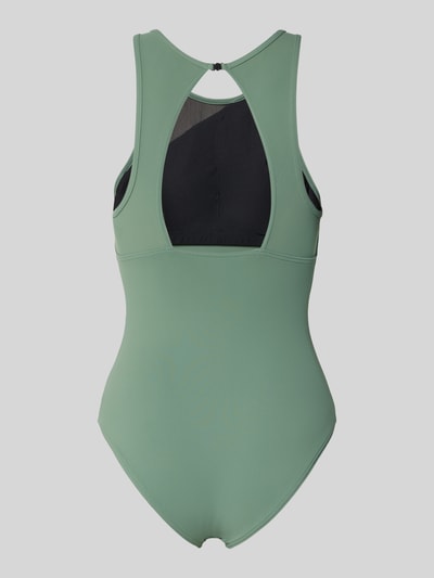 Frauenmodel trägt Slim Fit Badeanzug mit semitransparenten Partien von Arena in Grün mit Mesh, Elastischer-Material-Mix, Ärmelloses-Design, Ganzkörperansicht Rückansicht.