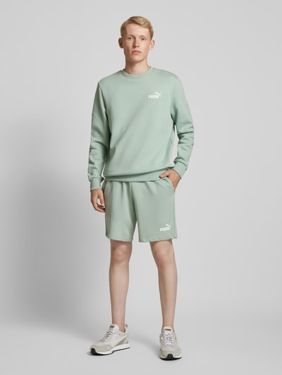 PUMA PERFORMANCE Szorty z dzianiny dresowej o kroju regular fit z nadrukiem z logo Limonkowy 1