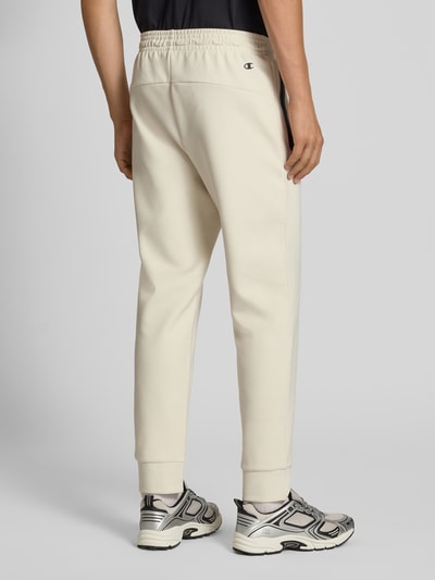 CHAMPION Spodnie dresowe z elastycznym pasem i tunelem Złamany biały 5