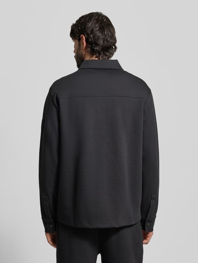 Männermodel trägt Regular Fit Sweatjacke aus Baumwoll-Mix Modell 'PE_TWIST' von BOSS Orange, Optik: Unifarben, Ganzkörperansicht Rückansicht.