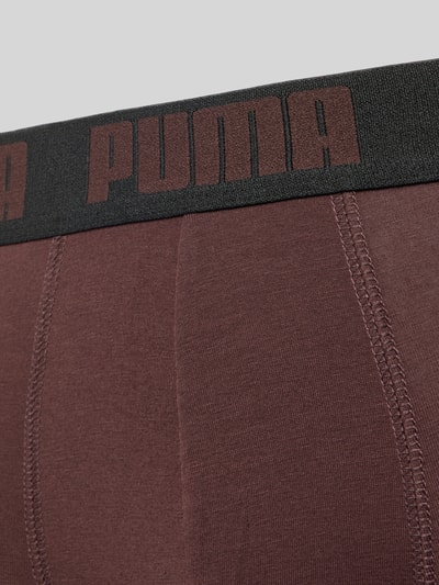 Produktfoto, Slim Fit Boxershorts aus Baumwoll-Mix im 2er-Pack Modell 'EVERDAY' von PUMA, braune Oberfläche mit schwarzem Bund und sichtbarem PUMA-Logo, Nahaufnahme Oberkörper, Herren Boxershorts von PUMA.