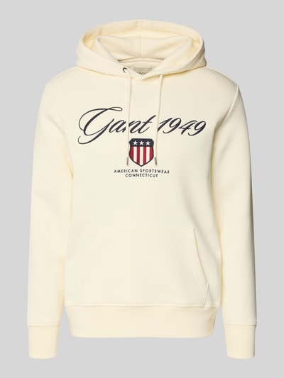 Productfoto, Hoodie met labelstitching en kangoeroezak van Gant in lichtgeel katoenmix, regular fit, ruglengte maat M 70 cm, mouwlengte 63 cm.