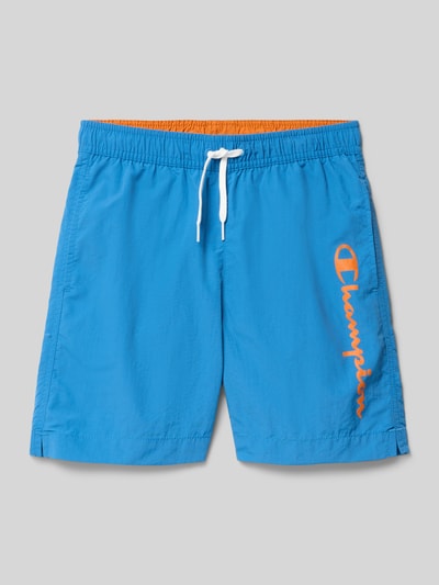 Produktfoto, zwembroek met loose fit en elastische band met trekkoord van CHAMPION, zij-steekzakken, oranje logoprint