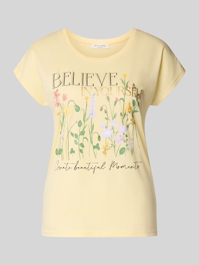 Produktfoto, damski t-shirt z nadrukiem z motywem, mieszanka bawełny i wiskozy, krój regular fit, okrągły dekolt, długość tyłu 54 cm, T-Shirt mit Motiv-Print von Christian Berg Woman, jasny żółty, kwiatowy nadruk, delikatna faktura
