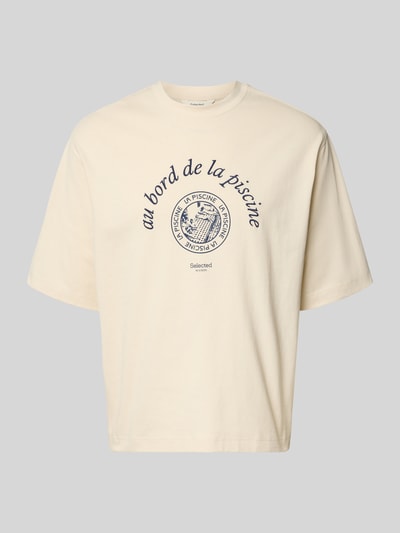 Produktfoto, Relaxed Fit T-Shirt aus reiner Baumwolle Modell 'BOXYNORMAN GRAPHIC' von SELECTED HOMME in Beige, Jersey mit blauem Motiv-Print und Rundhals.