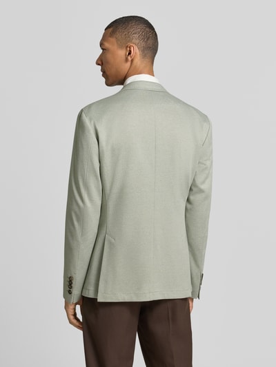 Männermodel trägt Sakko mit floraler Applikation Modell 'Hoverest' von JOOP! Collection, Viskose-Mix, Regular-Fit, Ganzkörperansicht Rückansicht.
