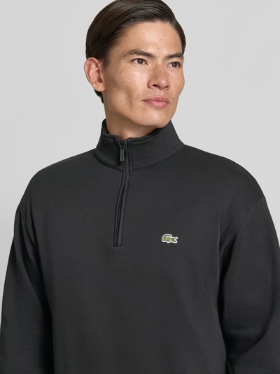 Mannelijk model draagt Regular Fit schipperstrui uit katoenmix van Lacoste, Heren schipperstrui, zwart, Nahaufnahme Oberkörper
