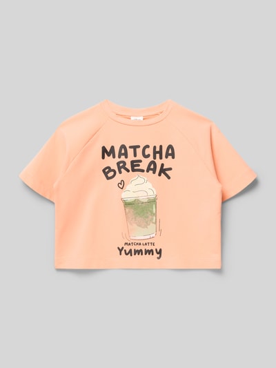 Produktfoto, Boxy Fit T-Shirt aus Baumwoll-Mix von s.Oliver RED LABEL, Kinder T-Shirt in Optik: Unifarben, Applikation: Schriftzug, Motiv-Print, Rundhals, Ärmelform: Kurzarm, Raglanärmel, pastellorange, glatte Textur.