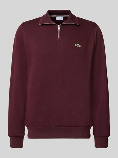 Produktfoto, bordeauxroter Regular Fit Troyer aus reiner Baumwolle von Lacoste, dezente Struktur, sichtbarer Zipper, Herren Troyer von Lacoste