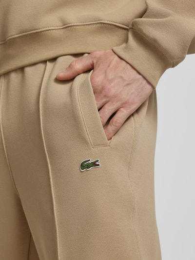 Lacoste Spodnie dresowe z ozdobnymi szwami z mieszanki bawełny Beżowy 3