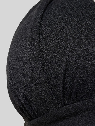 Produktfoto, Bikini-Oberteil mit Label-Detail Modell 'MAHO' von Banana Moon aus schwarzem Material-Mix mit Stretch-Anteil, strukturierte Oberfläche