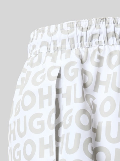 Produktfoto, Badehose mit Tunnelzug Modell 'KALY' von HUGO für Herren, weiß-graues Allover-Logo-Muster, glatte Textur