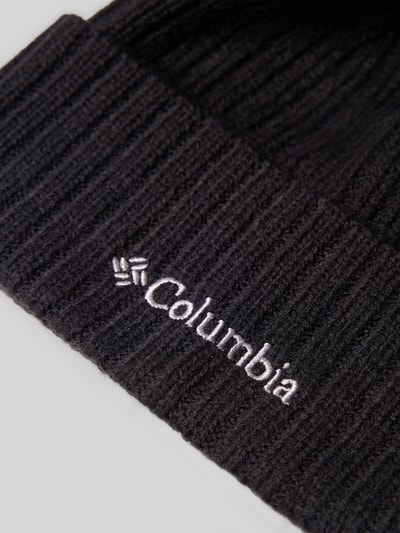 Produktfoto, schwarze Mütze in Strick-Optik Modell 'COLUMBIA' von Columbia mit Logo-Detail und fixiertem Saum auf hellem Hintergrund