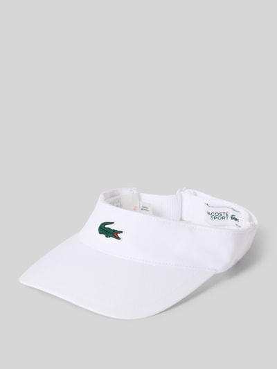 Produktfoto, weiße Visor Cap mit Logo-Patch von Lacoste Sport, glatte Textur, dezentes Krokodil-Logo auf der Vorderseite