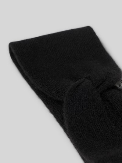 Produktfoto, Stirnband aus reinem Kaschmir von Christian Berg Woman in Schwarz, breites Design, Strick-Optik, Knotendetail, weiche Textur
