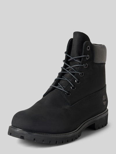 Produktfoto, schwarze Boots aus echtem Leder mit Logo-Detail von Timberland, abgerundete Form, Schnürverschluss, profilierte Sohle, context: Damen Boots von Timberland, Echtleder, abgerundet, Logo-Detail, Schnürverschluss, profilierte Sohle, Absatzhöhe 4 cm, Schafthöhe 15 cm, Schaftweite 10 cm