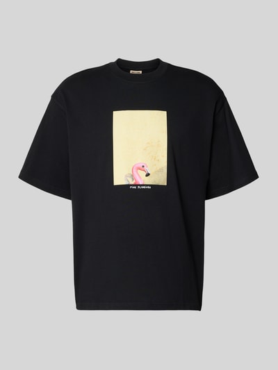 Produktfoto, Oversized T-Shirt aus reiner Baumwolle Modell 'COOPER' von Only & Sons in Schwarz, unifarben mit Motiv-Print Flamingo auf der Vorderseite, Rundhals, kurze Ärmel, glatte Textur.
