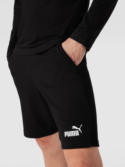 PUMA PERFORMANCE Szorty z dzianiny dresowej z nadrukiem z logo model ‘ESS’ Czarny 3