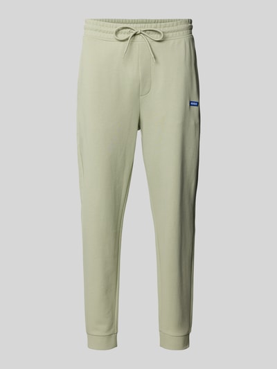 Produktfoto, Relaxed Fit Sweatpants aus reiner Baumwolle Modell 'NAPIN' von HUGO BLUE in Optik: Unifarben mit Label-Patch, Tunnelzug, Bundabschluss: elastisch, Beinabschluss: gerippt, seitliche Eingrifftaschen, Materialverarbeitung: Sweat.