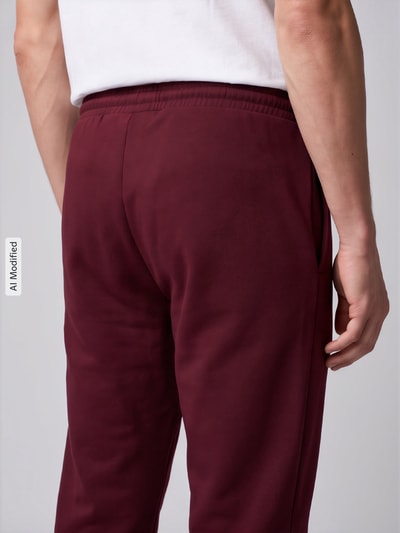 adidas Sportswear Spodnie dresowe o kroju regular fit z mieszanki bawełny model 'FEELCOZY' Ciemnoczerwony 3