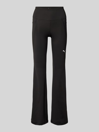 Produktfoto, schwarze Flared Leggings mit Logo von PUMA, High Waist, elastischer Bund, Material-Mix mit Stretch, glatte Textur