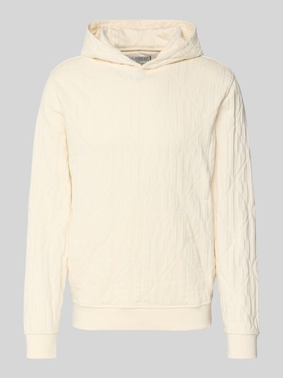 Produktfoto, cremefarbener Hoodie mit Känguru-Tasche und Kapuze von Guess aus reiner Baumwolle, elastische Abschlüsse, Loose Fit, strukturierte Oberfläche