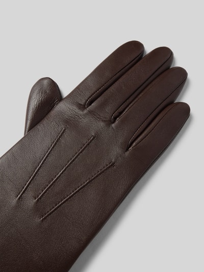 Produktfoto, Handschuhe aus echtem Leder von Roeckl in Dunkelbraun mit Ziernähten, Fleece-Innenfutter, metallic Label, Smartphone tauglich