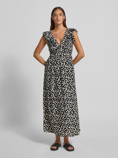Frauenmodel trägt Leicht ausgestelltes Maxikleid aus reiner Viskose Modell 'EASY JOY' von Vero Moda, Optik:Allover-Muster, Rüschen, Bundfalte, Gummizug, Bindeverschluss, Ärmelform: Ohne, Maxi-Länge, tiefer V-Ausschnitt, Volant-Saum, Material: reine Viskose, Ganzkörperansicht von vorne.