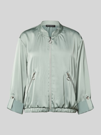 Produktfoto, Blouson mit regulierbarer Ärmellänge und Reißverschlusstaschen von Betty Barclay, satyna, krój regular fit, stójka, zamek błyskawiczny, kieszenie zapinane na zamek błyskawiczny, długość tyłu w rozmiarze 36: 53 cm, szerokość ramion w rozmiarze 36: 38 cm, szerokość klatki piersiowej w rozmiarze 36: 50 cm, długość rękawów w rozmiarze 36: 57 cm, jasna zieleń, lekko połyskująca tekstura, gładka powierzchnia.