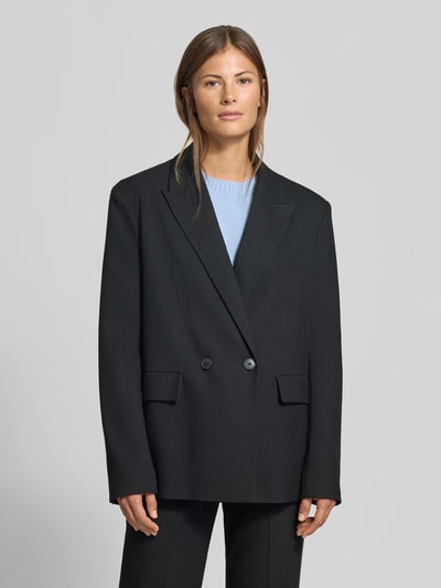 Frauenmodel trägt Relaxed Fit Blazer mit Viskose-Anteil von MYON, Schwarz, doppelte Knopfleiste, Reverskragen, Ganzkörperansicht von vorne. Elastischer Material-Mix, Rückenlänge 72 cm, Brustweite 48 cm, Ärmellänge 63 cm.