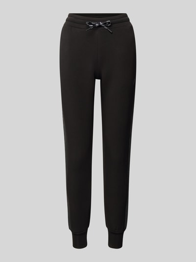 Produktfoto, schwarze Sweatpants mit elastischem Bund, Tunnelzug und französischen Eingrifftaschen, Modell 'ALLIE' von Guess Activewear, Viskose-Mix mit Stretch-Anteil, lockerer Schnitt, schlichte Oberfläche, vor grauem Hintergrund.