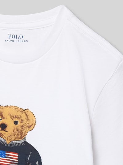 Produktfoto, Regular Fit T-Shirt aus reiner Baumwolle von Polo Ralph Lauren Teens, unifarben weiß, Rundhals, Feinripp, Motiv-Print Bär, Label-Schriftzug.
