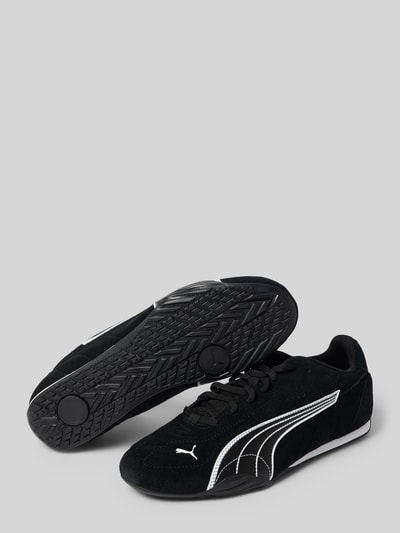 Produktfoto, Sneaker mit Logo-Detail von PUMA, schwarz mit weißen Linien, strukturierte Gummisohle, Damen Sneaker von PUMA