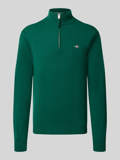 Produktfoto, Pullover aus reiner Wolle von GANT in Grün, Feinstrick, Troyer-Kragen mit Reißverschluss, langarm, hochgeschlossen.