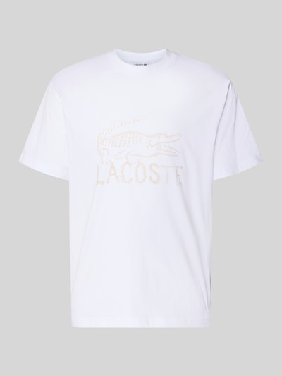 Produktfoto, Regular Fit T-Shirt aus reiner Baumwolle von Lacoste in Weiß, unifarben mit Logo-Print, Rundhals, kurzarm, glatte Textur.