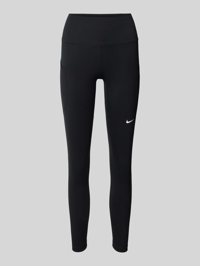 Produktfoto, schwarze Slim Fit Leggins mit Logo-Print von NIKE TRAINING aus elastischem Material-Mix, breiter Bund, minimalistische Optik.