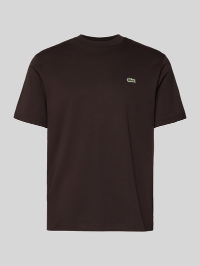 Produktfoto, Regular Fit T-Shirt aus reiner Baumwolle von Lacoste, jednokolorowy, krój regular fit, aplikacja z wyhaftowanym logo, naszywka z logo, okrągły dekolt, krótki rękaw, materiał: czysta bawełna.