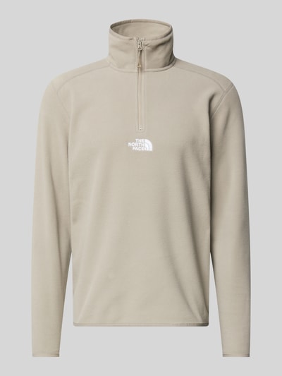 Produktfoto, Fleecepullover mit Reißverschluss Modell 'GLACIER' von The North Face, krój regular fit, stójka, logo z przodu, beżowa faktura, długość tyłu w rozmiarze M: 70 cm, długość rękawa w rozmiarze M: 67 cm