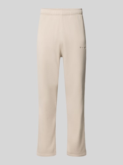 Produktfoto, gerade geschnittene beigefarbene Straight Fit Sweatpants aus Baumwoll-Mix Modell 'ICONS' von Champion mit Label-Stitching und Eingrifftaschen, sichtbare weiche Textur