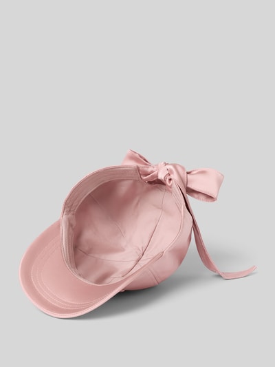Produktfoto, Cap mit Zierschleife Modell 'Arte' von JOOP! in zartem Rosa, glatte Textur, gebogener Schirm, sichtbares Logo-Stitching