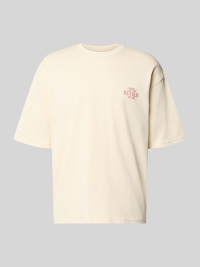 Produktfoto, Oversized T-Shirt mit rückseitigem Print von REVIEW aus cremefarbenem Bio-Baumwoll-Mix mit Rundhalsausschnitt und Logo-Print.