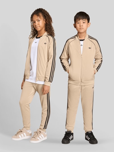 adidas Originals Spodnie dresowe krój regular fit z koniczyną Trefoil Beżowy 4